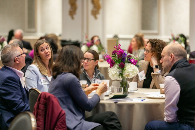 2023 Marketing Forum attendees at the table