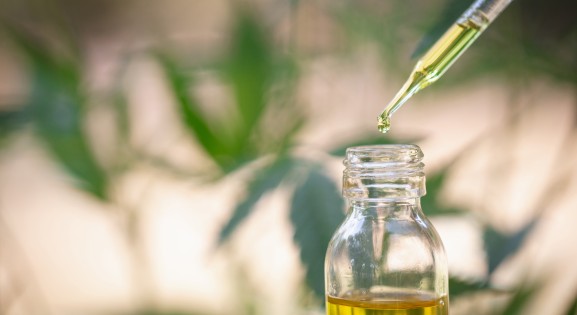 glass bottle and dropper containing CBD oil