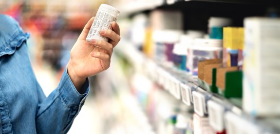 Customer in Store Looking at Label