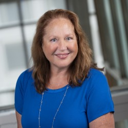 Mary McDonald Headshot in blue