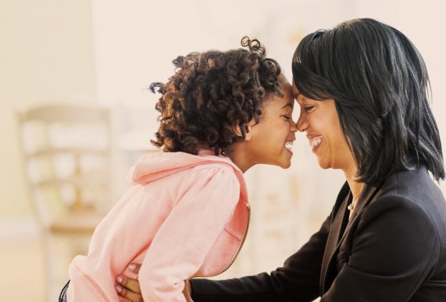 black mother and daughter showing affection