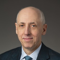 Scott Bass in suit and tie